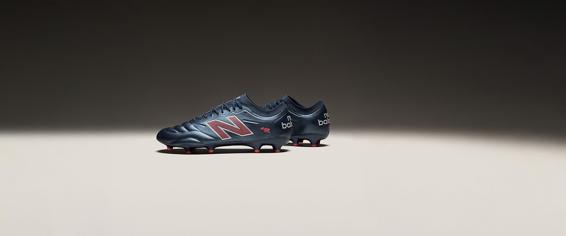 New Balance 442 Elite Firm Ground - Navy/Orange - Adult Cleats