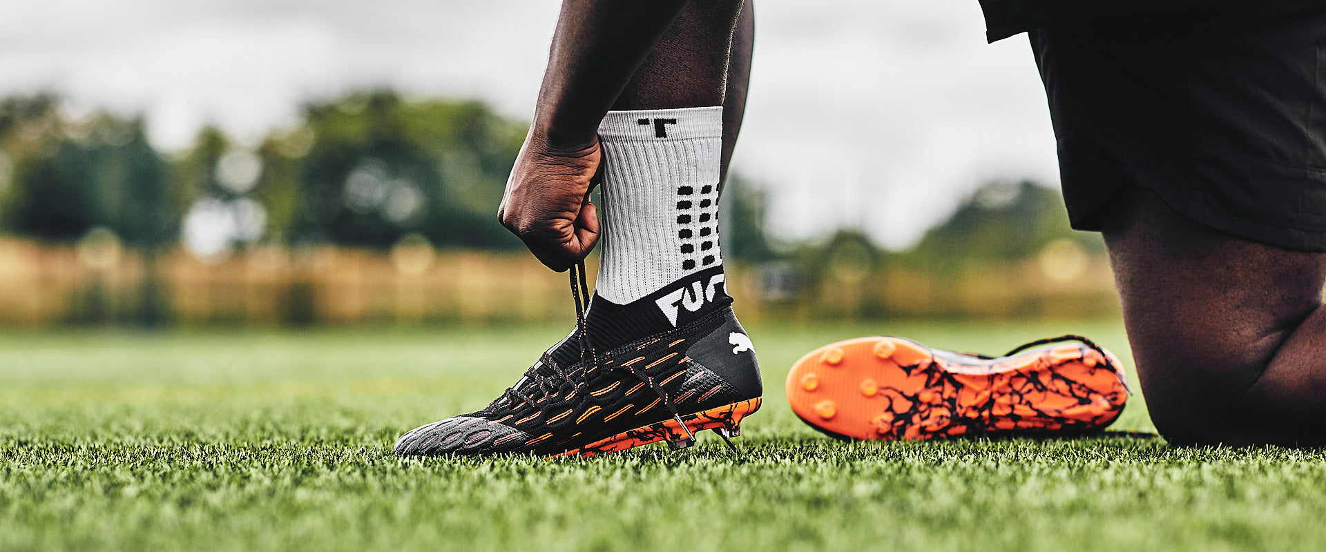 Puma Future 6.1 Netfit FG/AG - Black/White/Shocking Orange - Firm